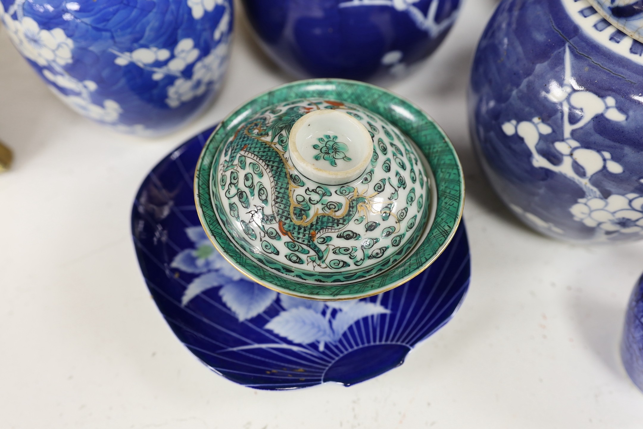 Eight Chinese blue and white ginger jars, one prunus vase and two others, the vase 25 cm high